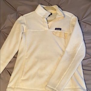 White patagonia sweatshirt.